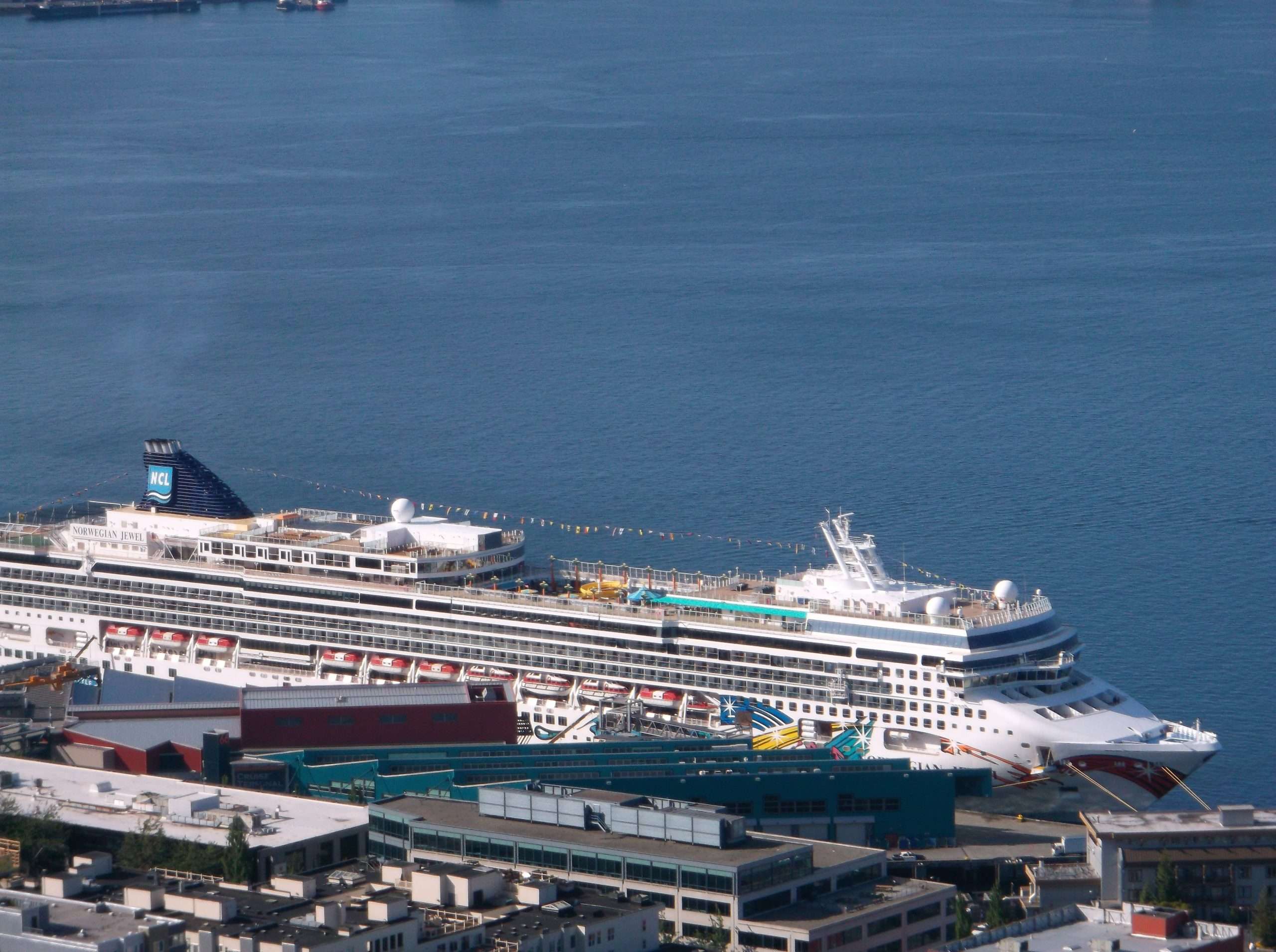 a cruise ship looking down at it from the space needle ...